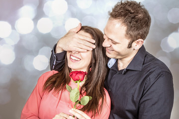 Valentine's day : man in love gives a rose to his beloved
