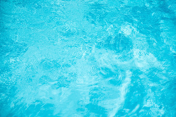 Blue ripped water in swimming pool. water surface background.