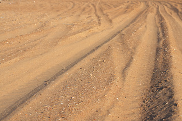 Road. Road in the desert along the sand dunes. Deserted landscape background. Picturesque desert highway..