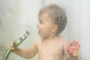 Young baby toddler boy in shower