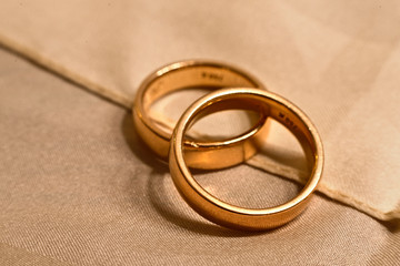 Wedding rings on cloth tight together