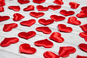 A lot of hearts on a wooden background, the concept of love and loyalty