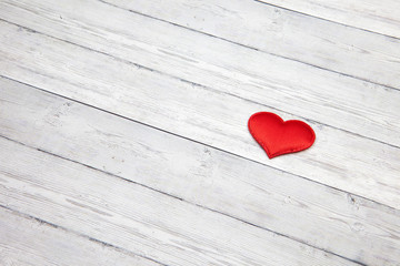 Red heart on wooden background, love concept, space for text.
