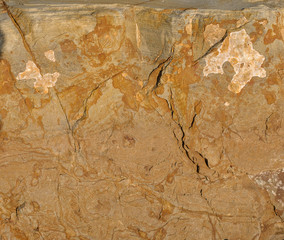 The natural stone or the surface of the stone as a background texture is large..