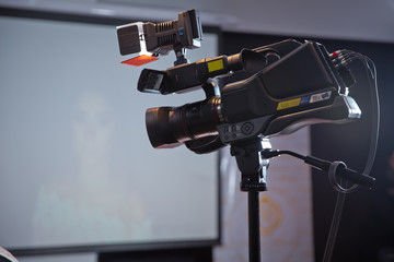 Camera recording publicity event . Press conference. Filming an event with a video camera. - Image
