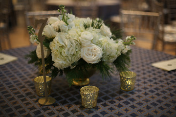Wedding Photography Bridal Reception White Roses and Hydrangeas in a Centerpiece