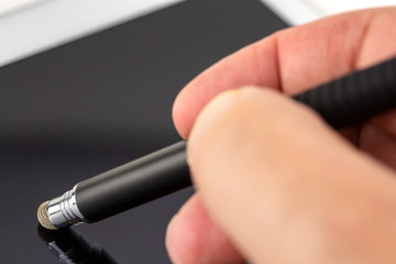 Man working with stylus and digital tablet pc