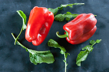 Dark food: red pepper and arugula