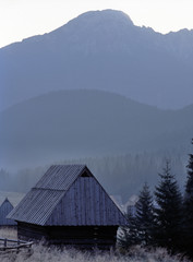 Shepherd's huts and Kominiarski Wierch Mountain, Tatry mountains, Poland © Maciej