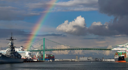 A rainbow over the Port of Los Angeles main channel, Battleship Iowa, a cruise ship, container port...