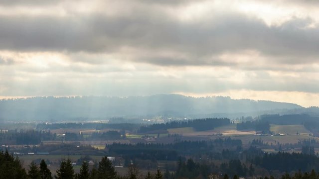 Ultra high definition 4k time lapse movie of moving clouds and sun rays over Chehalem Mountains and Tualatin Valley Oregon landscape in beautiful Pacific Northwest USA 3840x2160 UHD