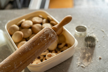rolling pin and cookie making equipment with a box full of tasty cookies and gingerbread