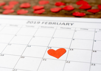 Fototapeta na wymiar Close up of red heart on day 14th of february 2019 calendar in Saint Valentines day celebrating Love