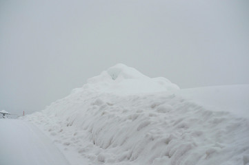 Fototapeta na wymiar Mounds of snow. Big snow cyclone in Bavaria