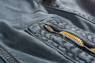 clothing items washed cotton fabric texture with seams, clasps, buttons and rivets