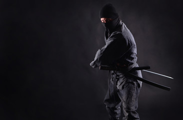 Ninja, samurai preparing to draw his sword © Dmytro