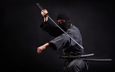 Ninja samurai with katana in attack pose