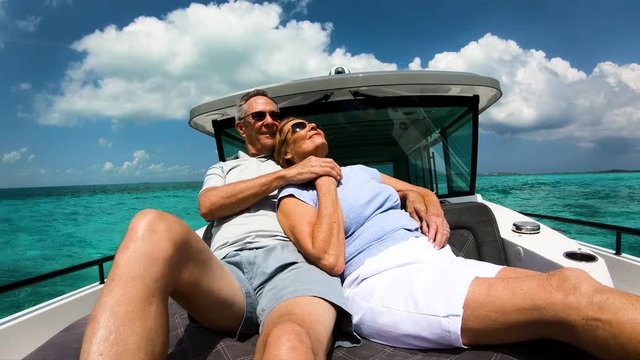 Carefree male and female seniors on sailboat Bahamas