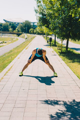 Man prepare to running on a track in a sunny day
