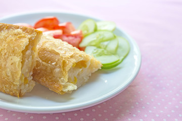 Corn pie with dish on table.