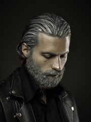 Portrait of tough old man in studio, shallow depth of field