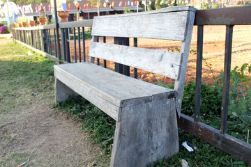 Big chair or long bench on gray stone walkway in garden public for people sitting and relaxing at holiday or vacation day use for your background or your design.