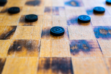 Checker game pieces, concepts of struggle, strategy and confrontation.