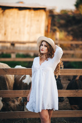 The girl in the white dress on the farm.