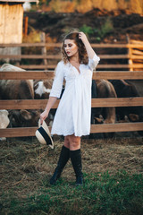 The girl in the white dress on the farm.