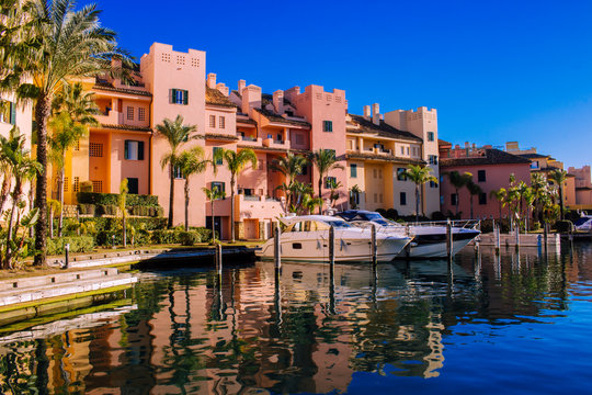 Port of Sotogrande. Port, sea, yachts and colorful houses. Sotogrande, Costa del Sol, Andalusia, Spain. Picture taken &ndash; 13 January 2019.