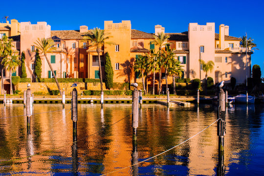 Port of Sotogrande. Port, sea, yachts and colorful houses. Sotogrande, Costa del Sol, Andalusia, Spain. Picture taken &ndash; 13 January 2019.