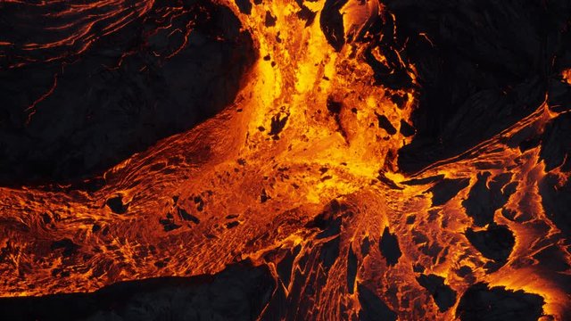 Aerial earth view of liquid volcanic lava flowing