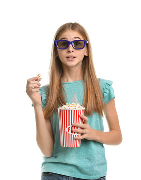 Emotional teenage girl with 3D glasses and popcorn during cinema show on white background