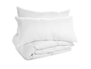 Soft blanket and pillows on white background
