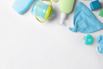 Flat lay composition with baby accessories and space for text on white background