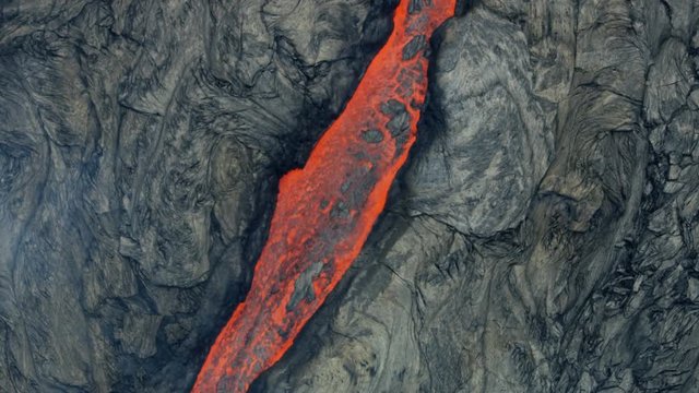 Aerial view of explosive volcano red hot liquid