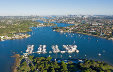 Aerial view of the Parramatta river and the Sydney city skyline to the east.
