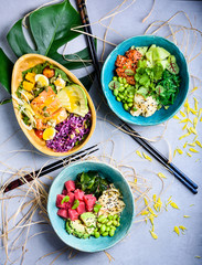Hawaiian fish poke bowls with salmon and tuna. Asian kitchen.