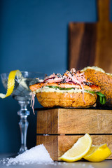 Fish Burger with salmon and lemon mayo, microgreens, fresh bun.