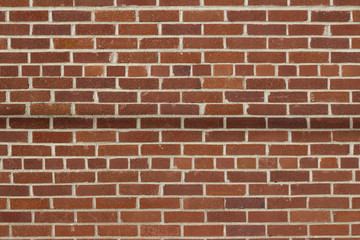 Fototapeta na wymiar Grungy vintage reddish brown brick wall in common bond pattern