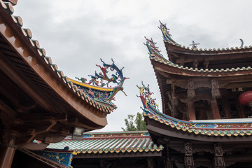 Fototapeta premium Detail of roof carvings on South Putuo or Nanputuo Temple