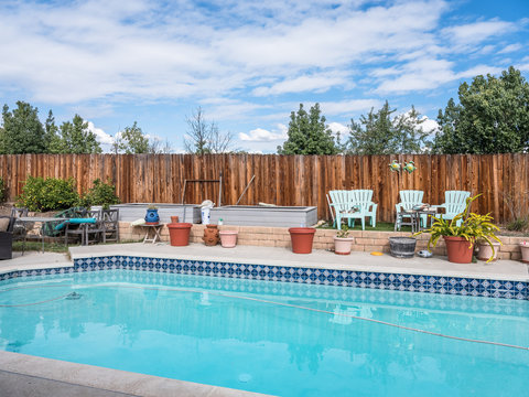 swimming pool in suburban backyard