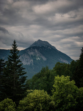 Scenic view of mountain against cloudy sky