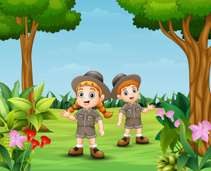 Obraz na płótnie Canvas Cartoon of zookeeper boy and girl in the garden