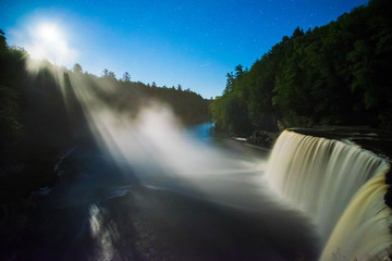 Fototapeta premium Moonlight Illuminates Mist from Tahquamenon Falls, Michigan