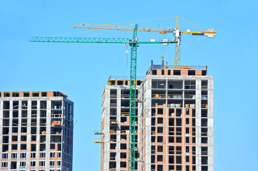 Crane and highrise construction site