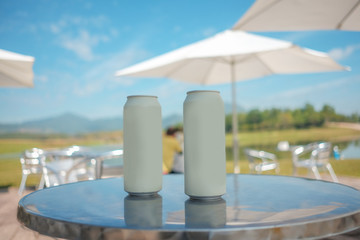 Beer cans on the table Parasols and natural views