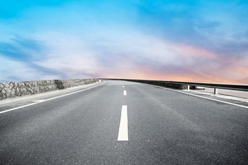 Fototapeta premium Sky Highway Asphalt Road and beautiful sky sunset scenery