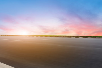 Fototapeta na wymiar Sky Highway Asphalt Road and beautiful sky sunset scenery