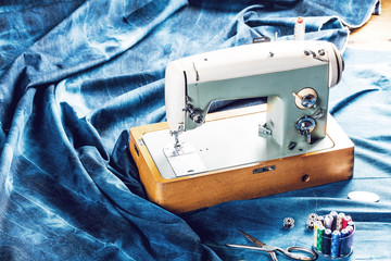 sewing indigo denim jeans with sewing machine, garment industrial concept.